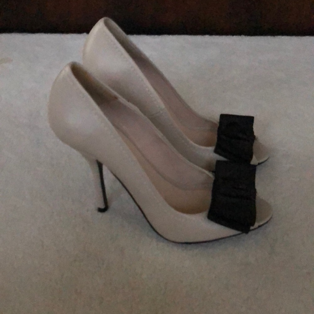 Peep toe heels with bow detail.